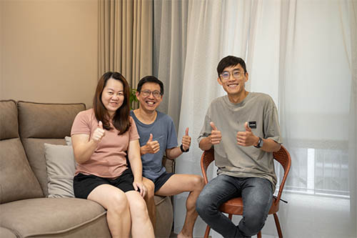 Happy homeowners at the handover of their renovated flat